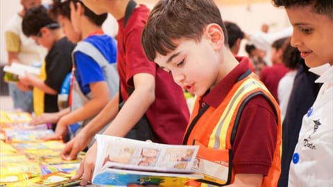 Pupils reading new books together