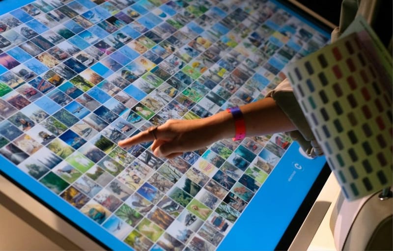 A hand using a large interactive display