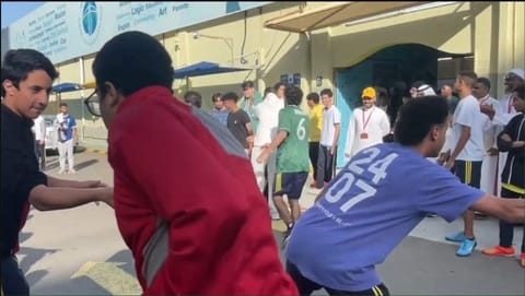 Students playing a game in the school courtyard