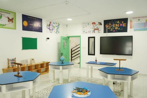 Science lab with hexagonal tables and an interactive screen